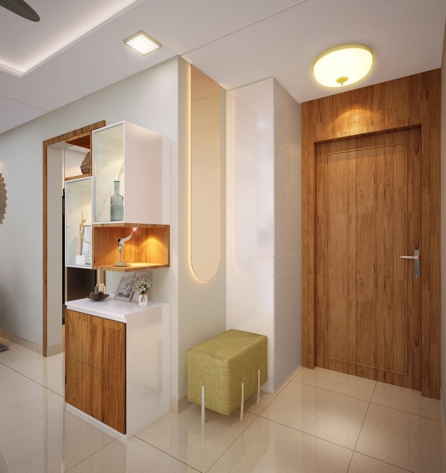 Sudhir Yadav Residence entrance foyer with a gold-framed mirror and console