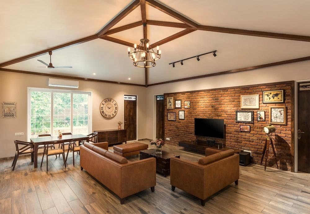 Farmhouse living room in Badalapur with exposed wooden ceiling beams, a 14-foot ceiling and a warm wood-panelled TV console