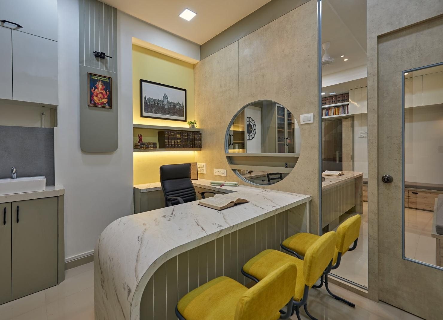 Law office reception desk in Dombivli in marble and wood with mustard-yellow seating