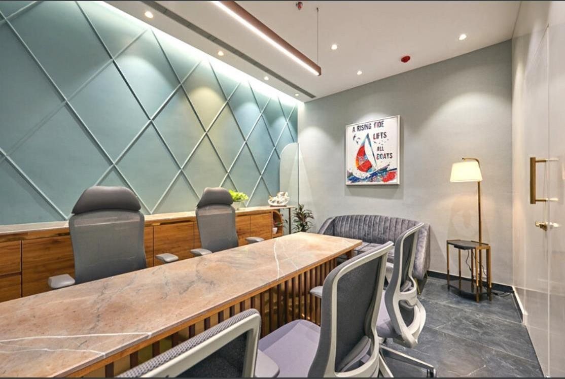Sethwala Food Solutions conference room with a teal geometric feature wall