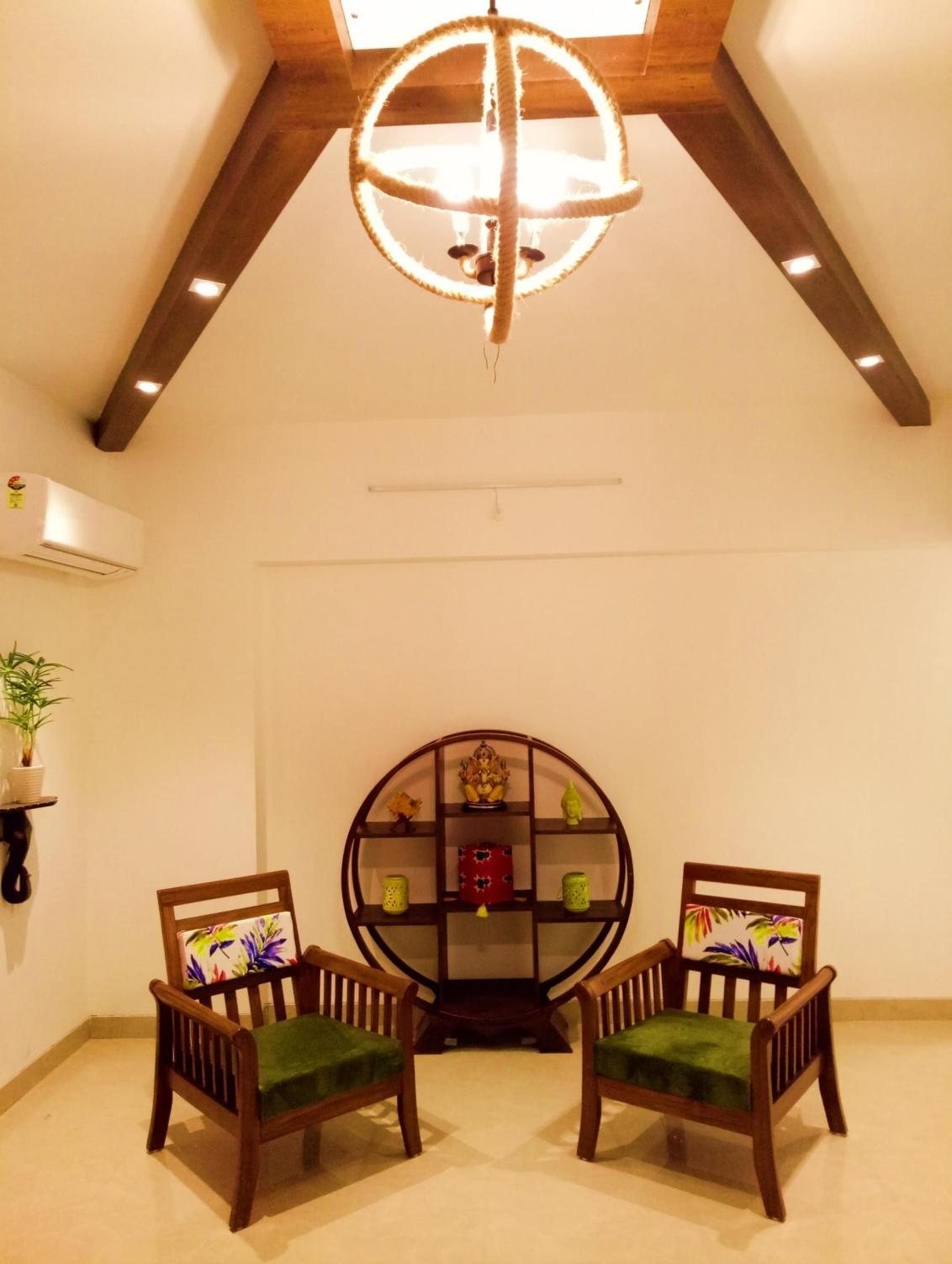 Weekend home in Goa with a vaulted wood-beamed ceiling and a rope-wrapped circular pendant light